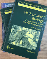 Mathematical Biology, by James Murray, superimposed on Intermediate Physics for Medicine and Biology.