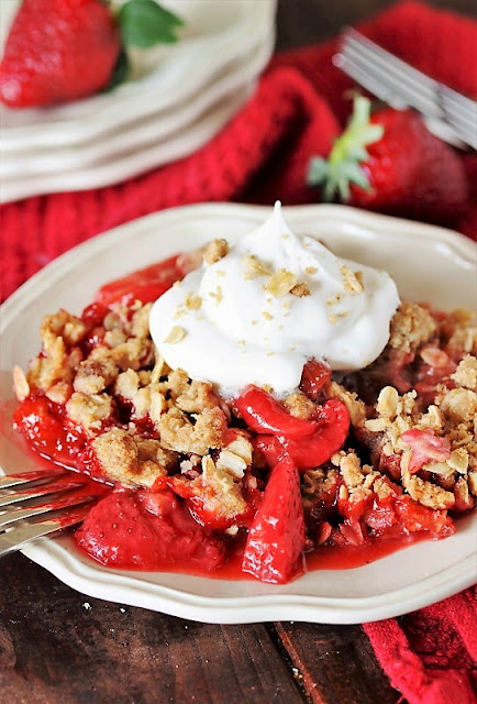 Fresh Strawberry Crisp Topped with Whipped Cream Image