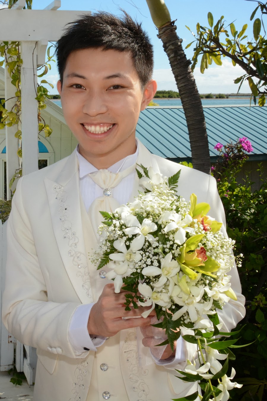 Hawaii Wedding Flowers Groom Holds the Bouquet
