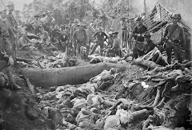 The bodies of Moro insurgents killed by US troops during the Battle of Bud Dajo in the Philippines, March 7, 1906. 