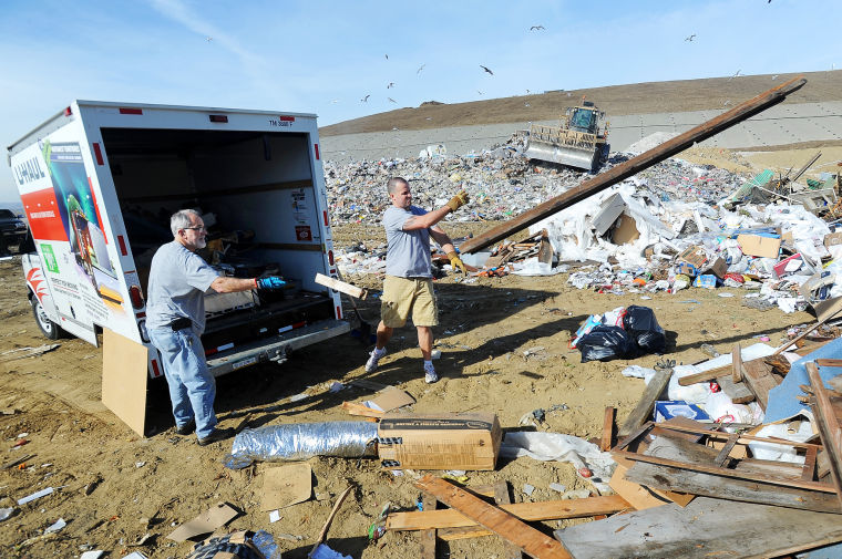 MEC&F Expert Engineers A worker directing traffic at the John Smith