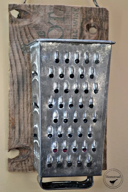 vintage cheese grater on rustic board