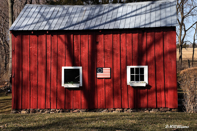 Little red barn with flag