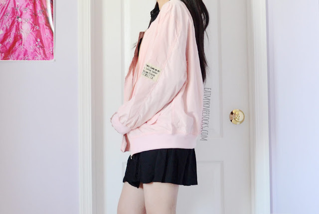 SheIn Fashion Review: Pastel Pink Bomber Jacket Details on the oversized pastel pink bomber jacket from SheIn, featuring front pockets and a badge/patch embellishment for a cute streetwear look.