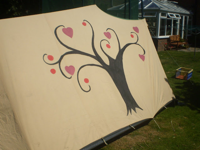 painting a canvas tent with fabric paints