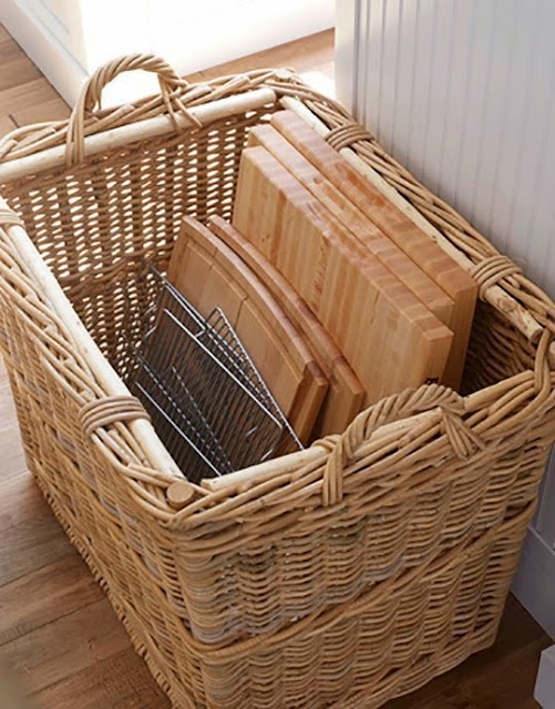 Use baskets for organizing cutting boards in the kitchen :: OrganizingMadeFun.com