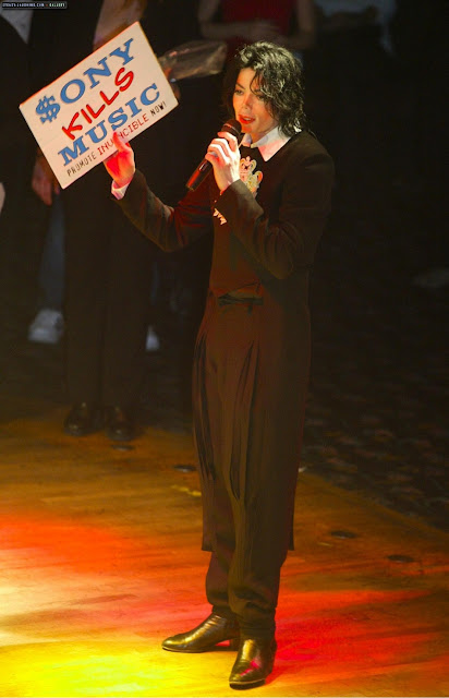 Michael Jackson at the Equinox Club, London. Holding a sign Sony Kills Music Michael Jackson at the Equinox Club, London. Holding a sign Sony Kills Music