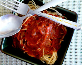 Hearty Meat Sauce for a hot and filling spaghetti dinner. Developed to have a bit of a kick to it, but the heat can easily be toned down. This chunky meat sauce can be made stove-top or in a slow cooker. | Recipe developed by www.BakingInATornado.com | #recipe #dinner