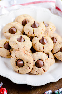 Made with 4 simple ingredients, these peanut butter blossoms are the perfect addition to your holiday cookie plate!