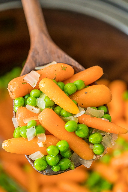 Slow Cooker Honey Glazed Peas and Carrots - easy and delicious side dish! Baby carrots, honey, butter, garlic, onion, marjoram, and peas. Amazing flavor!! Great side dish for your holiday meal! #slowcooker #sidedish #vegetables Slow Cooker Honey Glazed Peas and Carrots - easy and delicious side dish! Baby carrots, honey, butter, garlic, onion, marjoram, and peas. Amazing flavor!! Great side dish for your holiday meal! #slowcooker #sidedish #vegetables