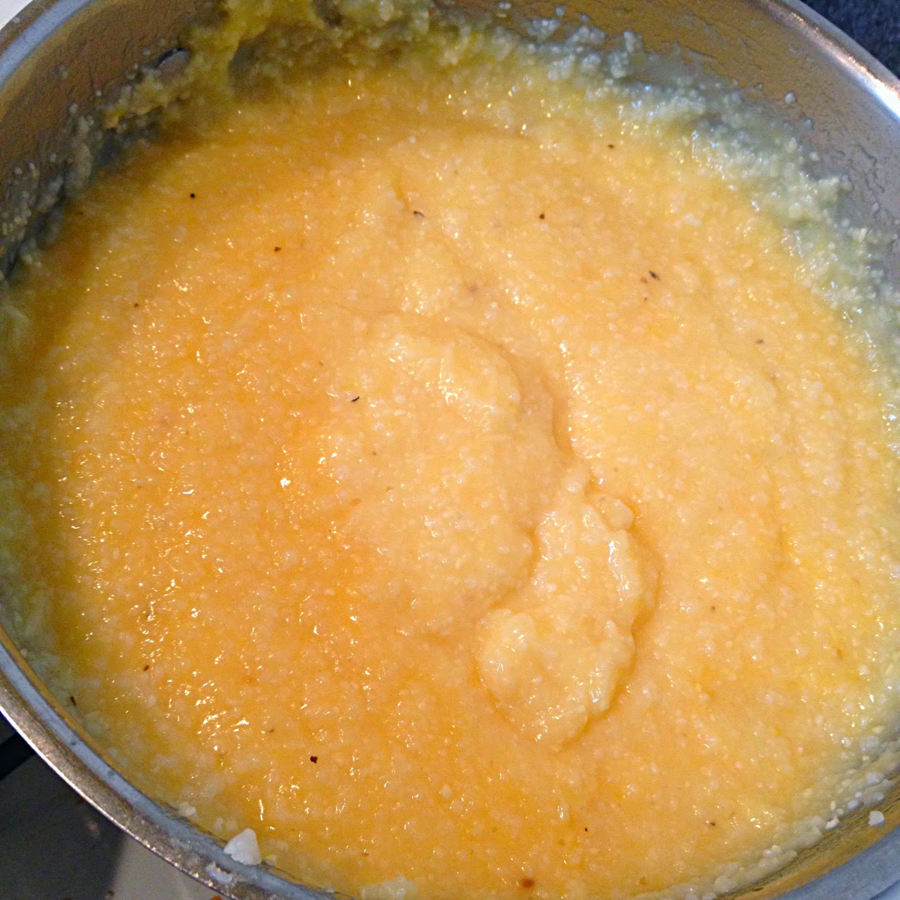 Smothered Chicken Over Creamy Cheese Grits