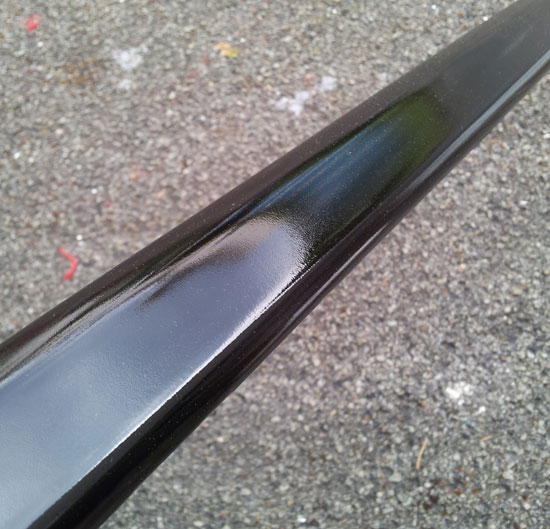 painted car part before cutting and polishing