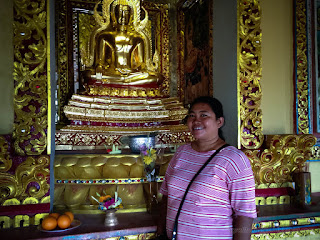 Traveler Woman In The Altar Room With Golden Buddha Sculpture At The Wall In Buddhist Monastery North Bali Indonesia