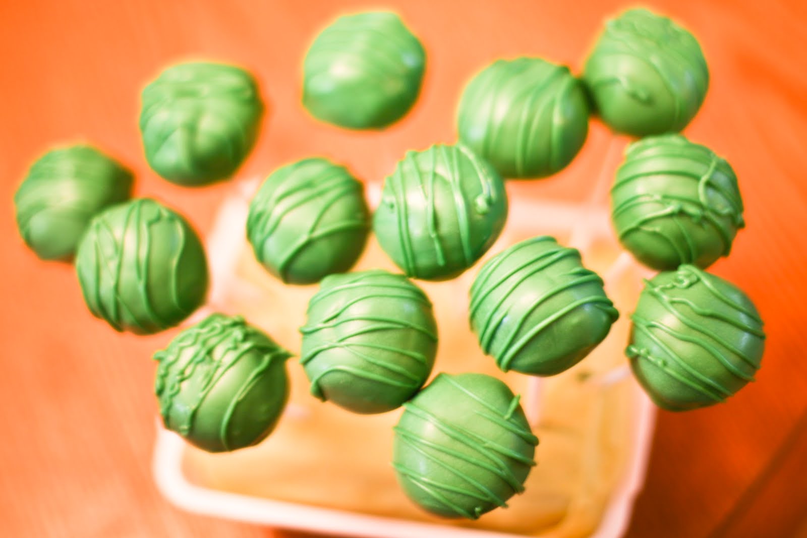 Pink Frosting Bakery Pink and green cake pops