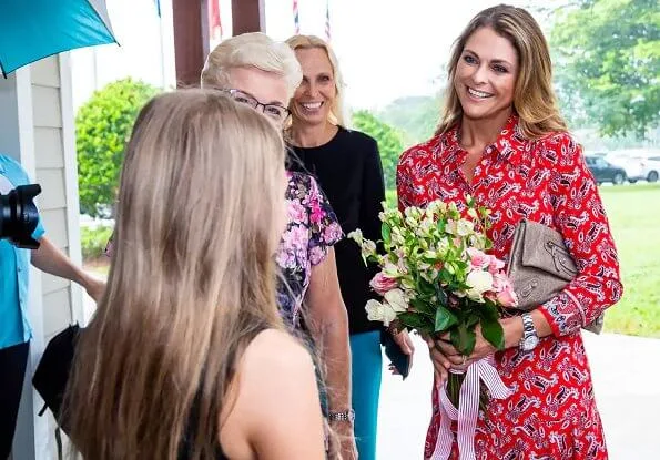 Princess Madeleine wore a new asymmetric paisley-print silk dress by Veronica Beard, and Ebba Brahe earrings. Leonore, Nicolas and Adrienne