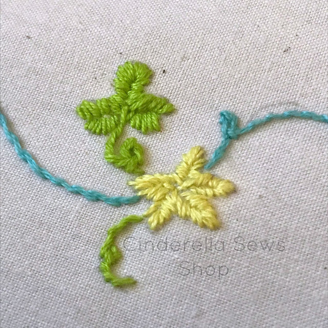 Learn how to do a leaf embroidery stitch for all of your botanical embroidery and needle point projects! Also get a look at my brand new Cinderella inspired glass slipper embroidery pattern featuring this pretty stitch. Includes video tutorial of leaf stitch. #embroidery #sewing #sewingtutorial #sewingpattern #videotutorial #DIY #crafting #textile #needlepoint