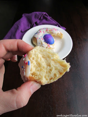 hand holding piece of easter bread with soft interior showing
