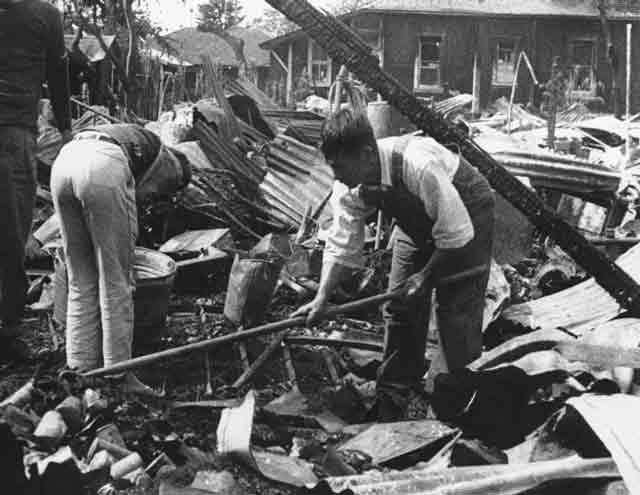 Cleaning up wreckage on Hawaii, 17 December 1941 worldwartwo.filminspector.com