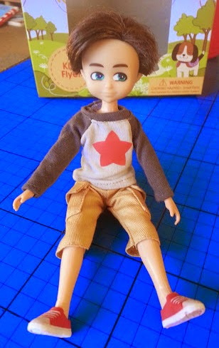 Finn Doll for boys sitting on the ground