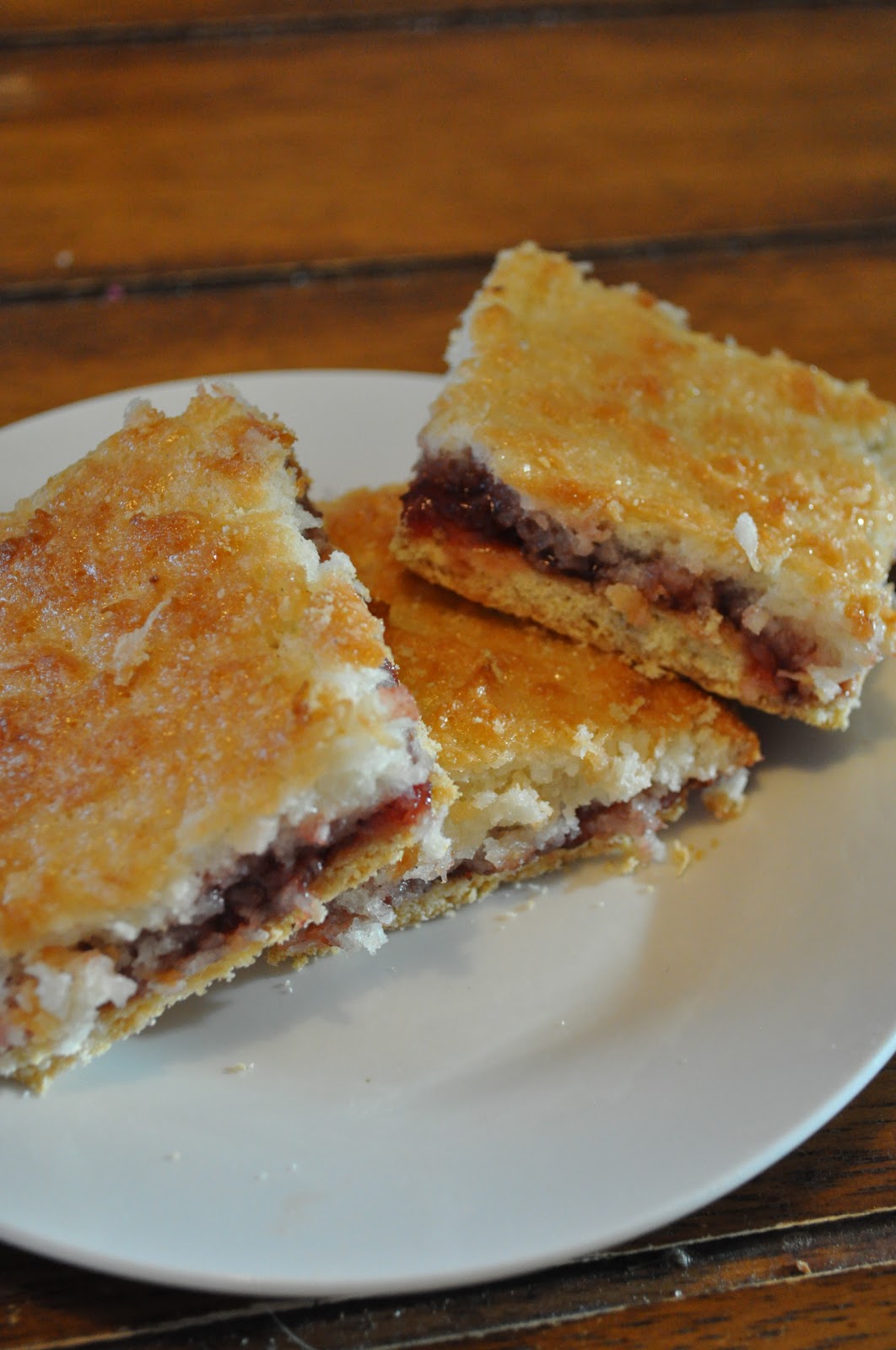 Cookies and Cakes and all things baked! Coconut Jam Sandwich Bars