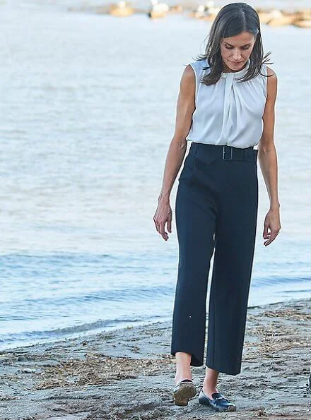 Queen Letizia wore Hugo Boss Iyabo silk top, Boss cropped wide leg trousers and hugo boss Italian-leather flats