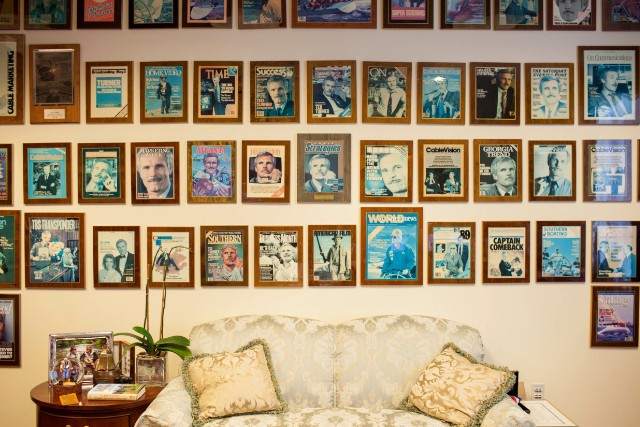 Framed magazine covers adorn a wall in Ted Turner's Atlanta office.