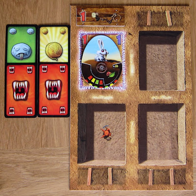 Dungeon Petz - A players Display board with a pet (Direbunny), a cage Addon and 4 Needs cards