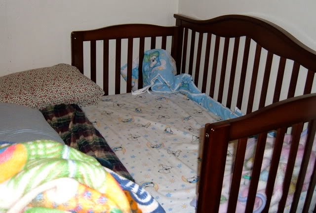 crib connected to bed