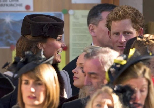 Kate wore a MaxMara dress and completed her look with a brown hat and drop-pearl earrings