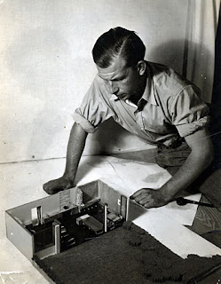 Eero Saarinen with A Combined Living-Dining-Room-Study project model, created for Architectural Forum magazine, circa 1937