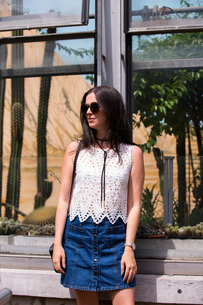 70s style in wrap choker, eyelet top and denim a-line skirt