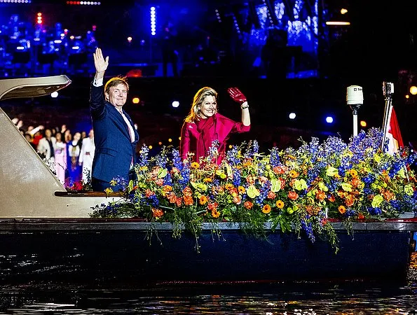 Queen Maxima wore a red top and red trousers. by Natan.Sarah's clutch bag. Carré Royal Theatre and around Amstel River