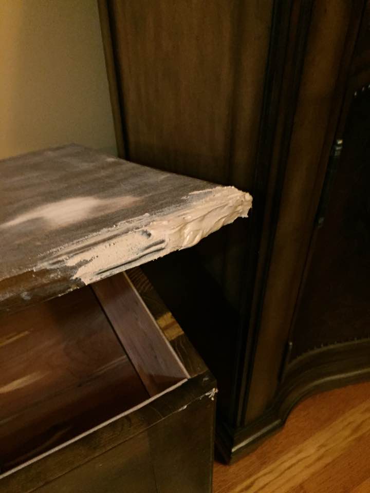 Second layer of wood filler to repair broken wood. Second layer of wood filler to repair broken wood.