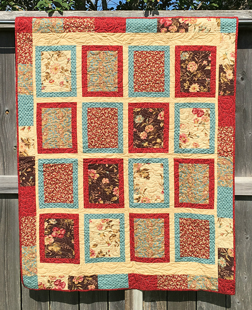 Framed Fat Quarter Quilt Free Pattern designed by Seattle Quilt Company, featuring Four Coordinated Fat Quarters