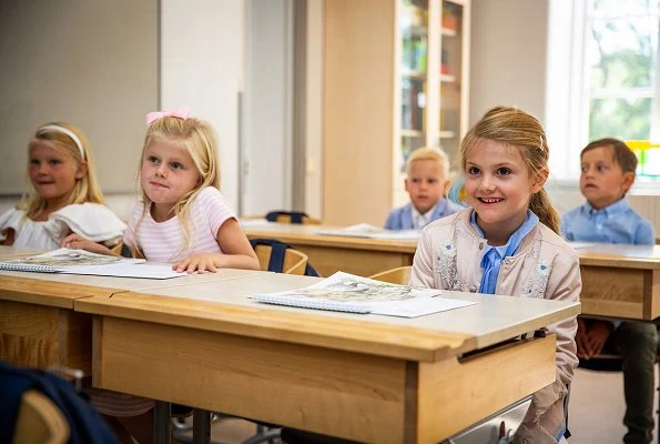 Crown Princess Victoria is wearing Baum und Pferdgarten skirt and blouse. Princess Estelle on the first school day