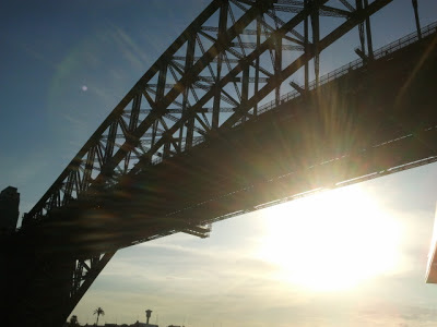 Sun shining through Sydney harbour bridge Sun shining through Sydney harbour bridge