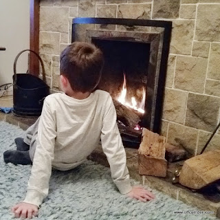 In front of the fire