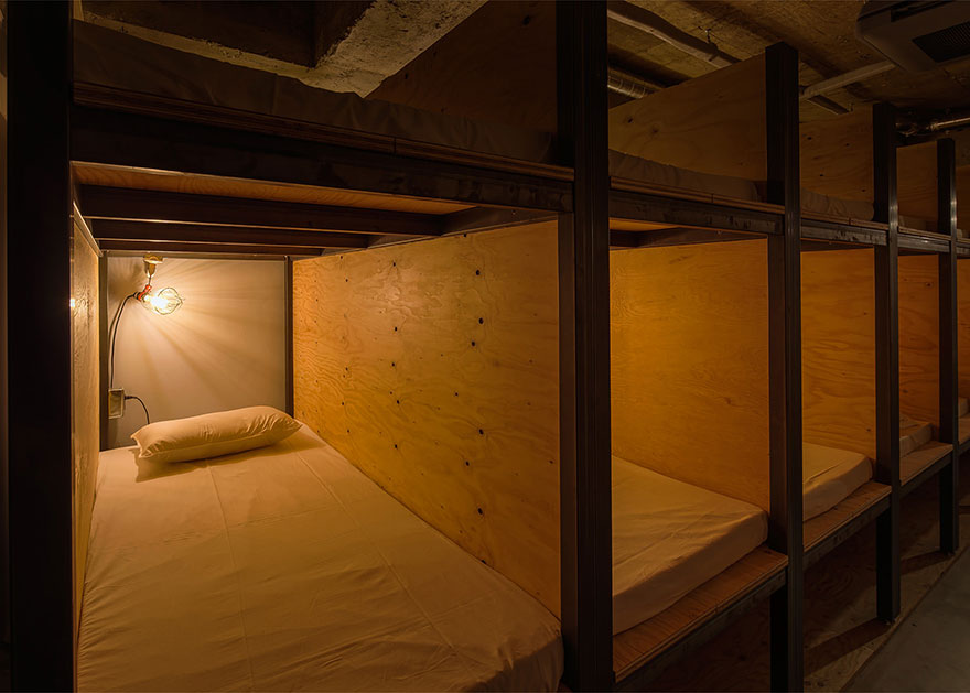 The compartments are small, but the price is right for such a prime location! - Bookstore-Themed Tokyo Hotel Has 1,700 Books And Sleeping Shelves Next To Them