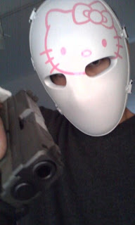 Weird and creepy Hello Kitty bullet proof face mask and gun