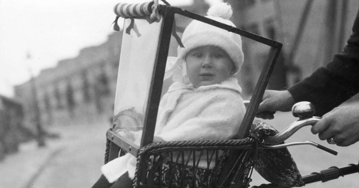 Child seat with toddler front of the bike, Amsterdam, Netherlands, 1925