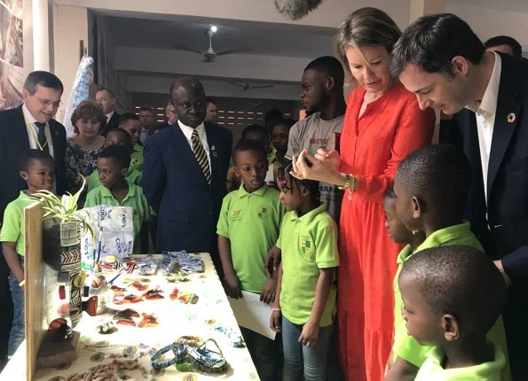 Queen Mathilde wore Natan floral print dress, Natan shoes an carried Natan clutch for visit Televic e-lab, SDGs and Unicorne Siona in Ghana