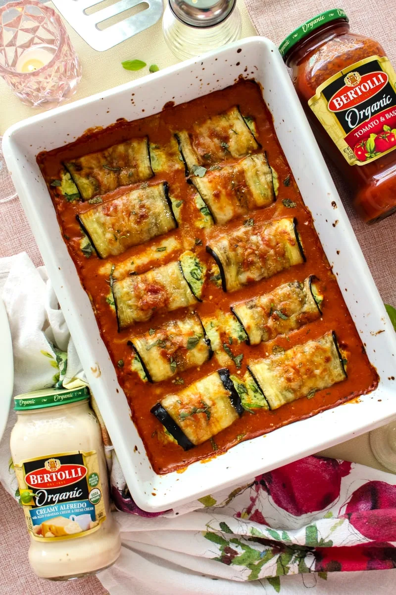 Eggplant Rollatini Rosa is a meatless dinner that features cheese and spinach stuffed eggplant baked in a creamy mixed Rosa Sauce. It is the perfect dinner recipe for your next special occasion! #eggplant #dinnerrecipe @Bertolli #sponsored
