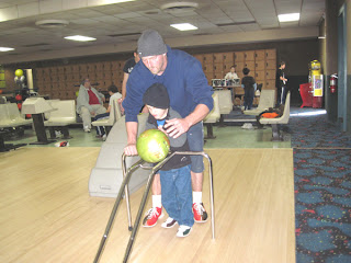 seven-year-old Dalton bowling with his dad