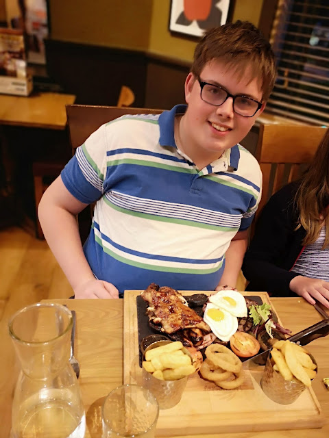 teen boy with large mixed grill