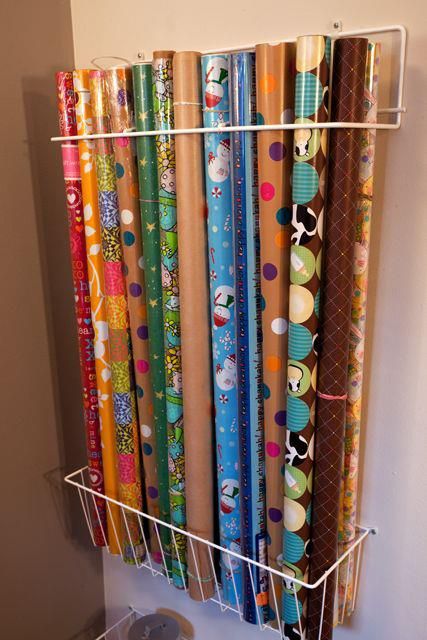 Put wrapping paper in this simple wire baskets on the wall :: OrganizingMadeFun.com