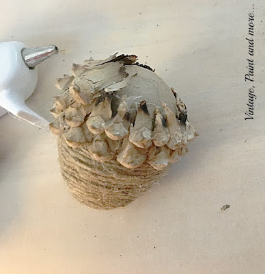 Vintage, Paint and more... gluing the seeds around the top of the paper mache egg to make the cap of the twine wrapped acorn