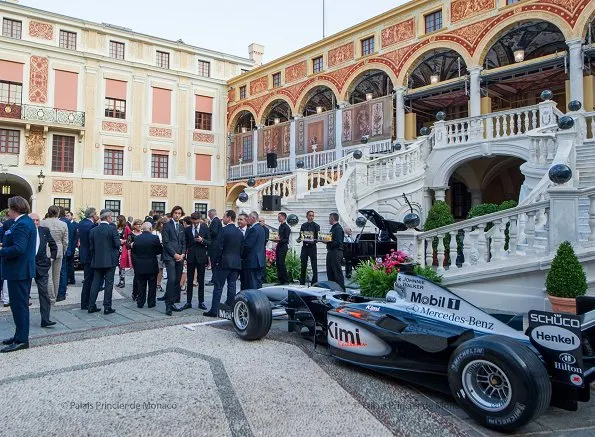 Prince Albert and Princess Charlene held a reception for 75th Monaco Grand Prix Formula 1 at Principality Palace. Princess wore Akris Pantsuit