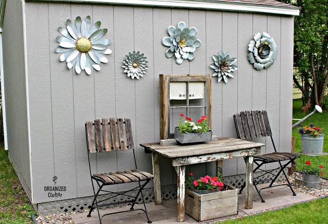 Decorating a Home Depot Shed Kit with JUNK #junkgarden #gardenjunk #flowergarden #containergarden  #stencils