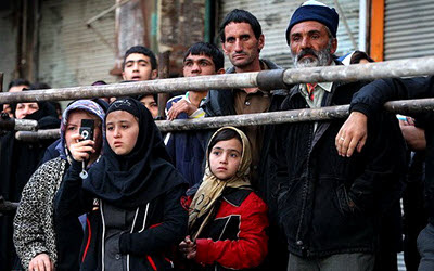 Children watching a public hanging in Iran