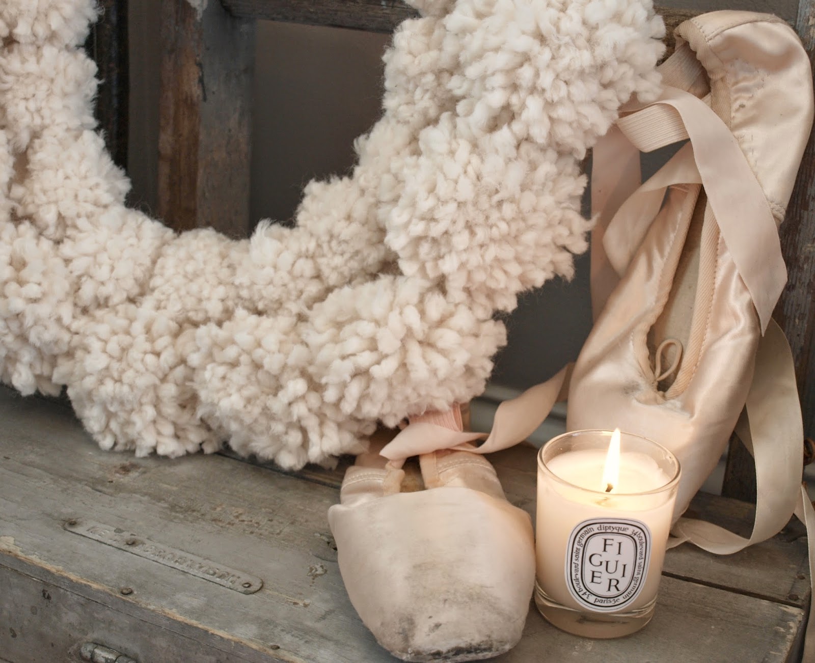 Hello Lovely Studio wooly pom pom Christmas wreath, pink pointe shoes, Diptyque candle